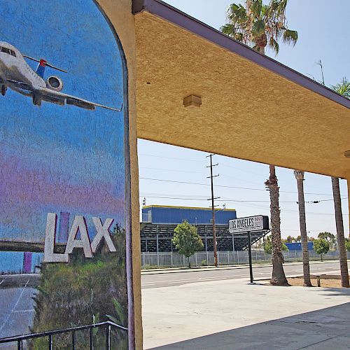 The image shows a mural with a plane, 